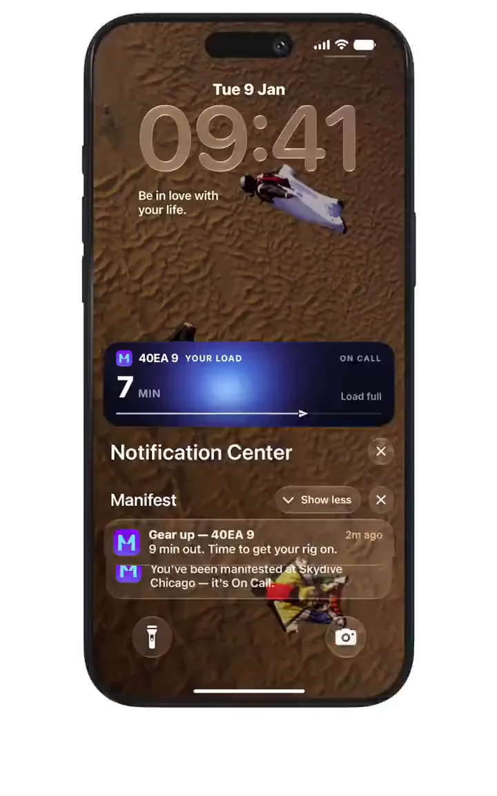 A Manifest load on the iPhone Lock Screen, 7 minutes to the call, with a Gear up notification